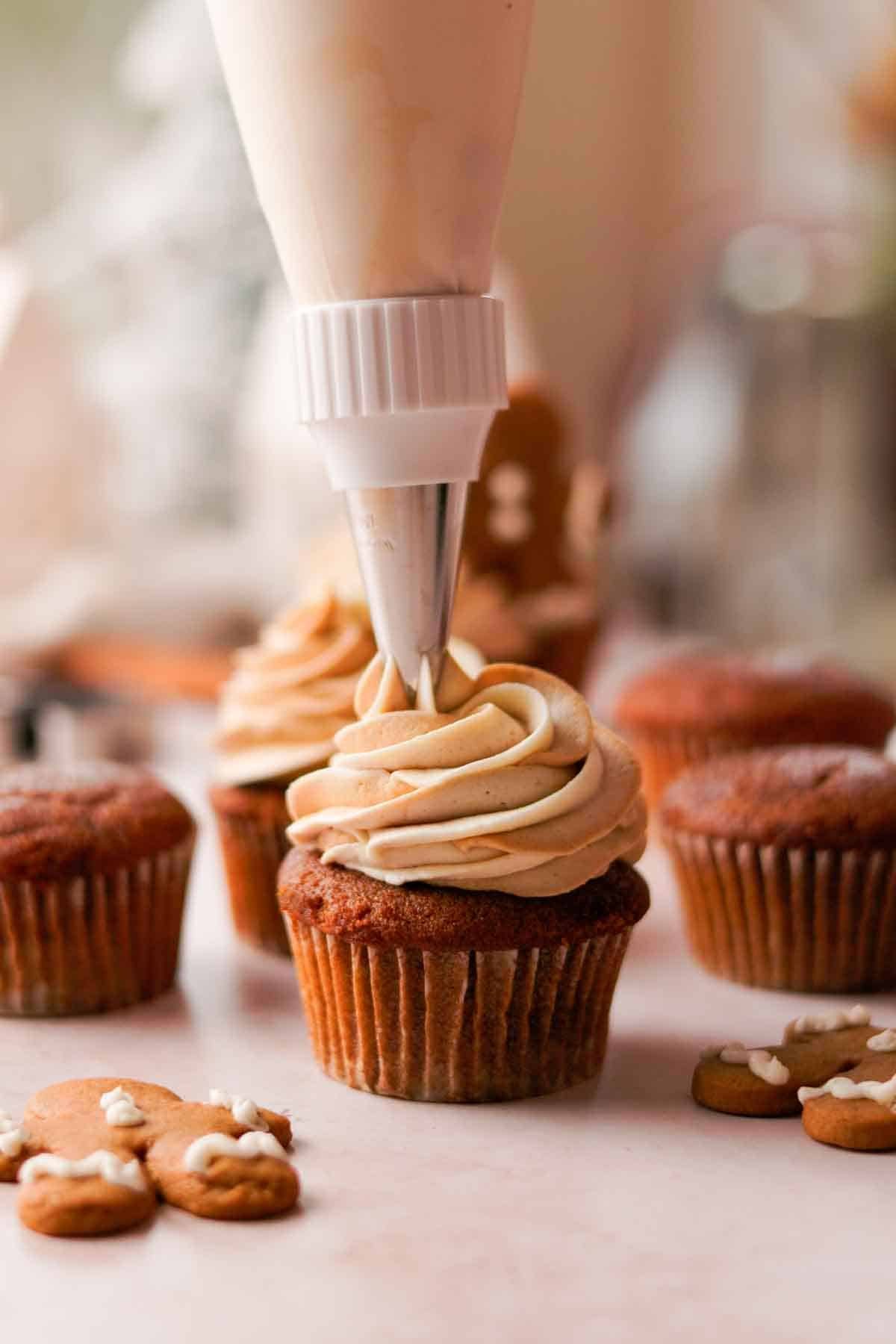 frosting cupcake with swirled gingerbread cream cheese frosting