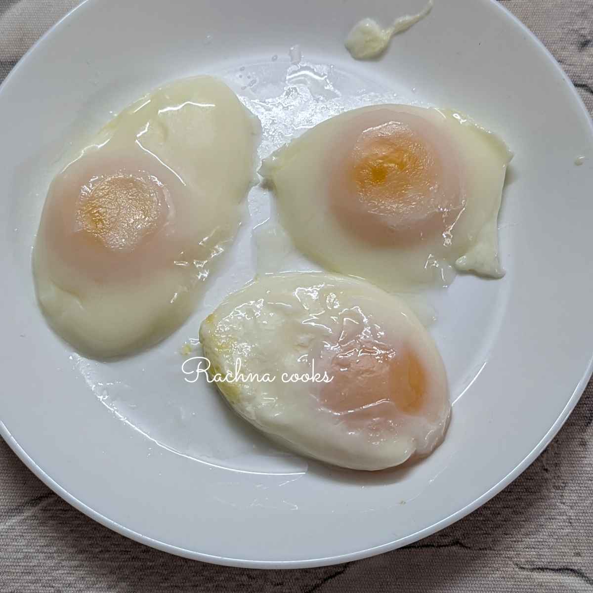 3 Poached eggs placed on a plate.