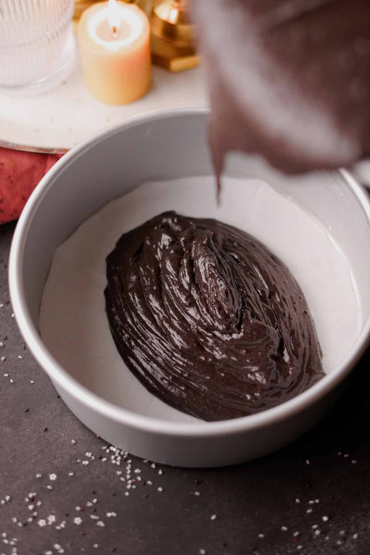 filling cake pans with black velvet cake batter