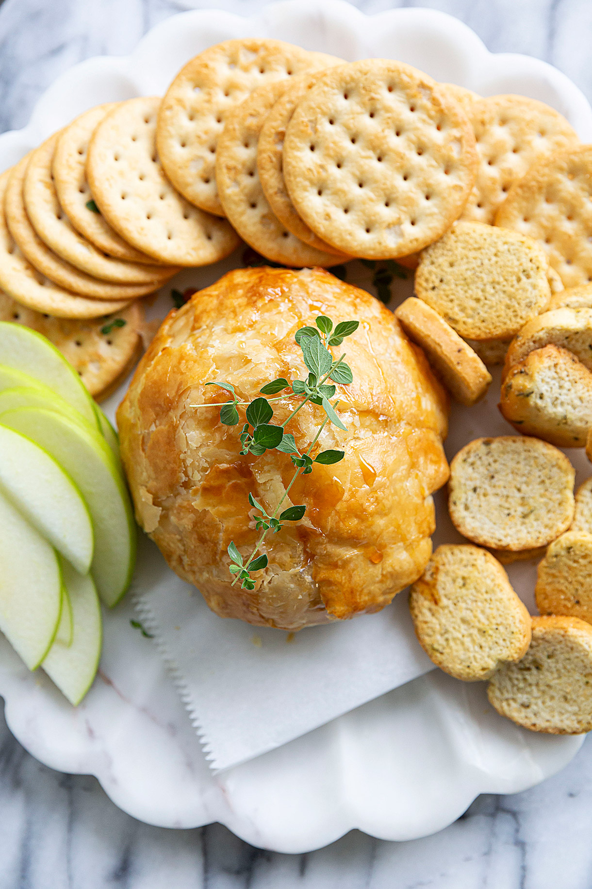 puff pastry baked boursin cheese with crackers appetizer