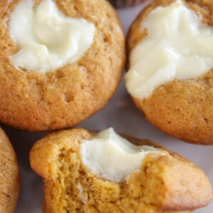 three pumpkin cheesecake muffins up close.