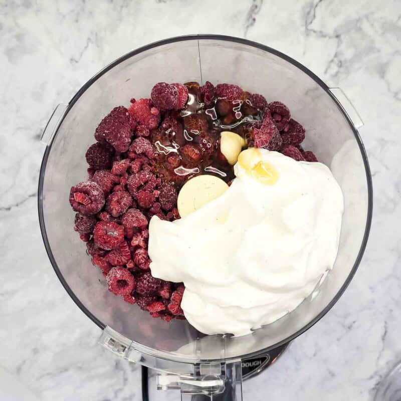 Overhead view of process shot 1 - place all ingredients in a blender or food processor.