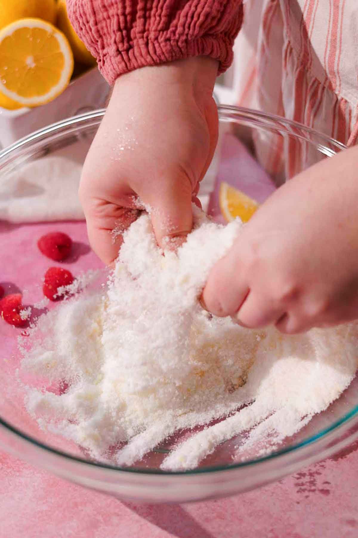 rubbing sugar and lemon zest with fingers 