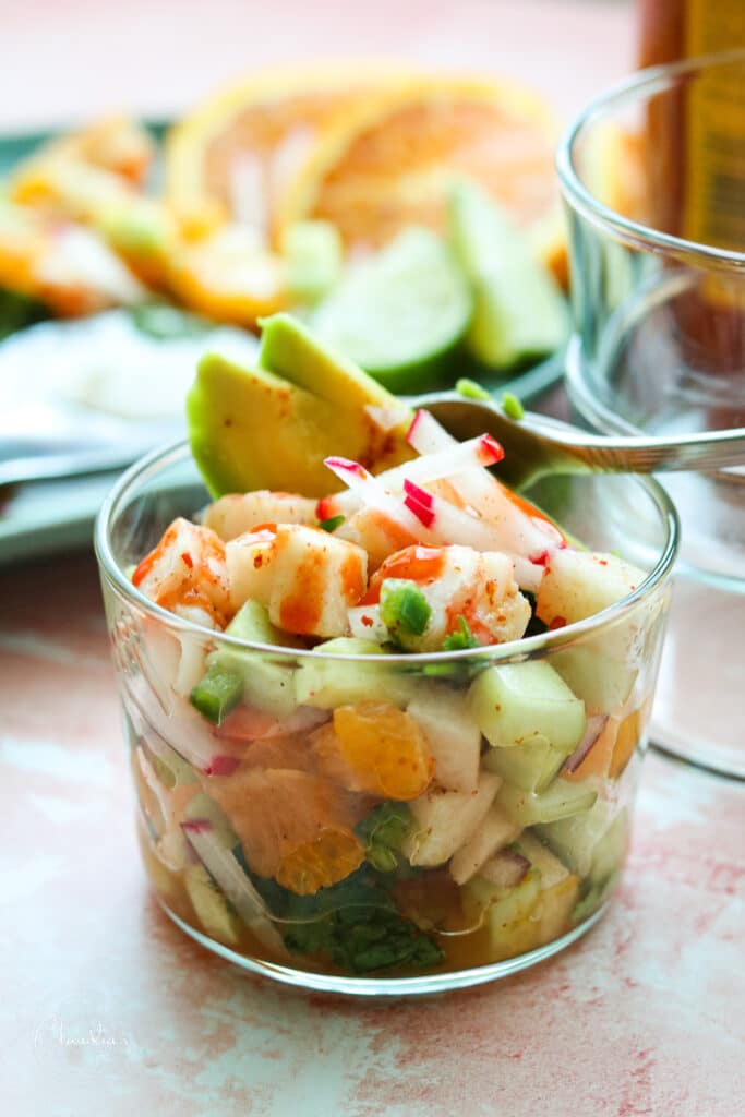 shrimp and avocado salad in small cup with avocado