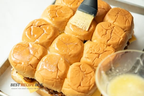 Brushing the slider tops with butter