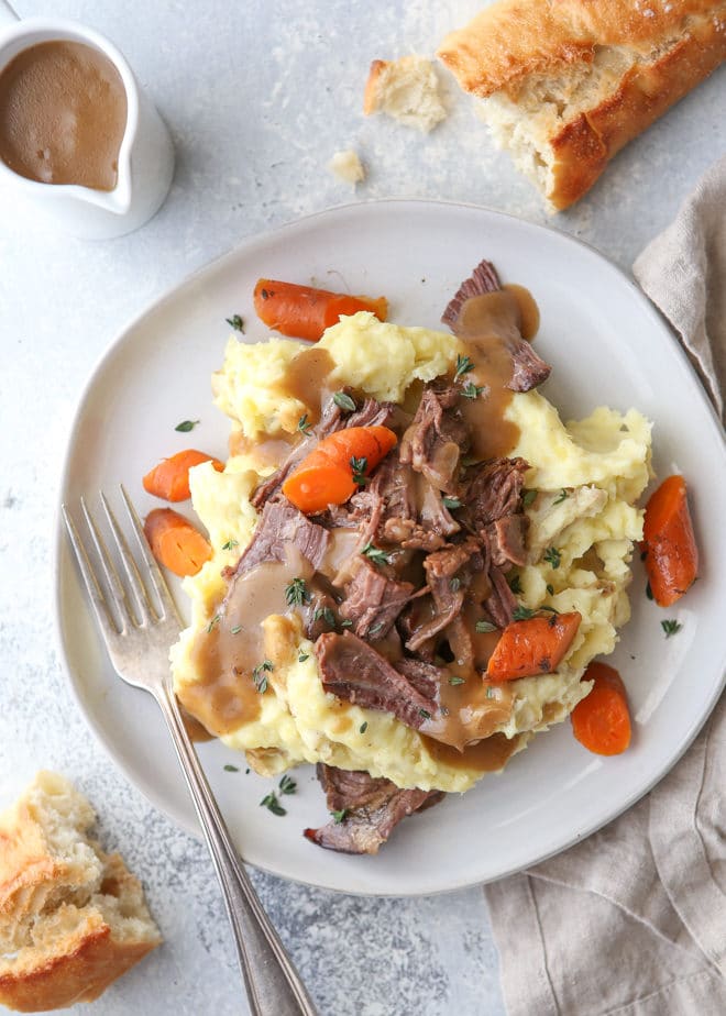 This classic pot roast recipe cooked in the slow cooker is fall-apart tender and full of so much flavor.