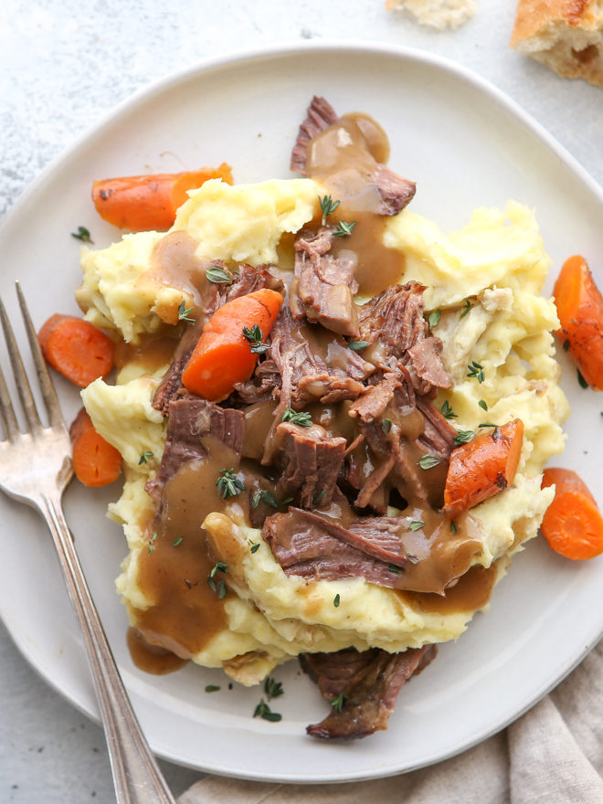 This classic pot roast recipe cooked in the slow cooker is fall-apart tender and full of so much flavor.
