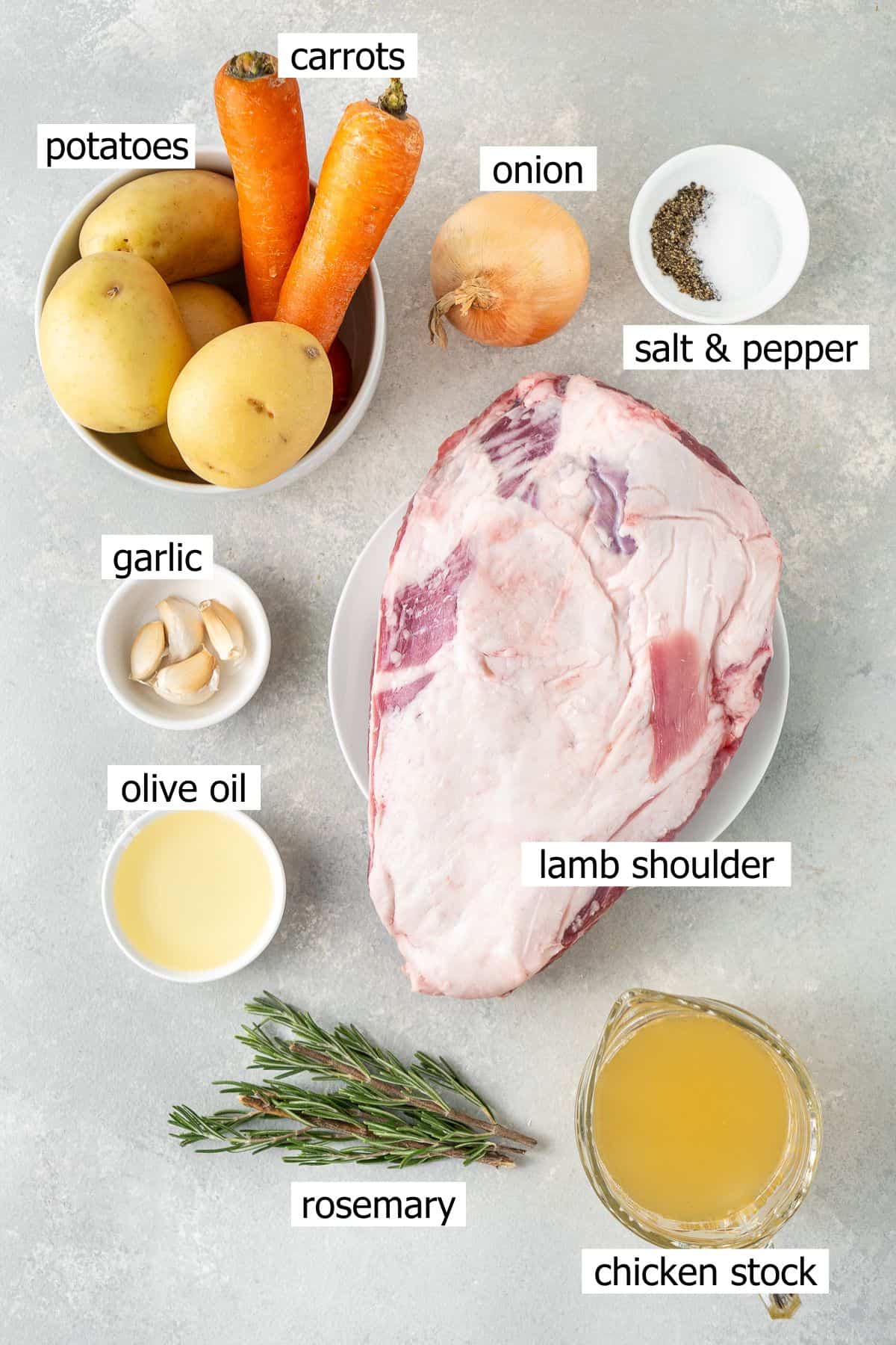 All ingredients you need to make slow roasted lamb shoulder laid out in bowls.