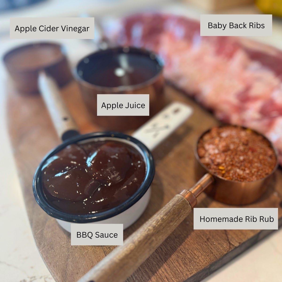 ingredients for smoked ribs recipe: ribs, rib rub, apple juice apple cider vinegar, bbq sauce and ribs