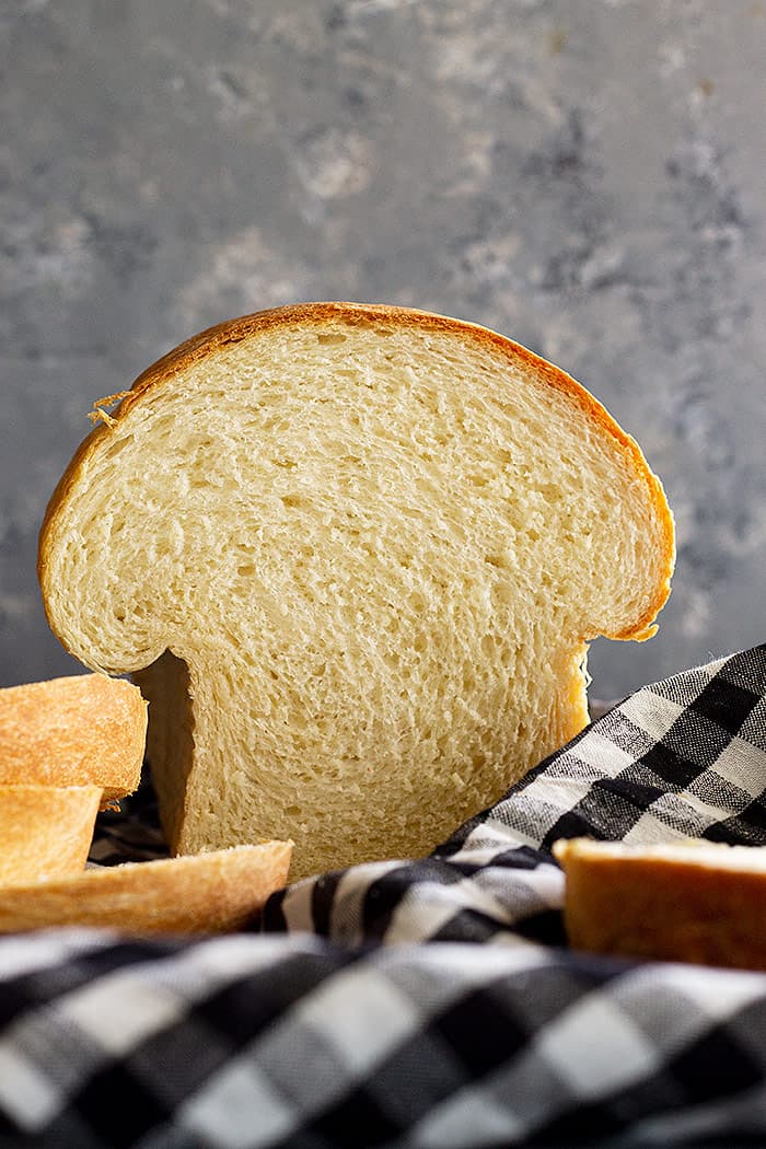 Loaf of bread that has been sliced into.