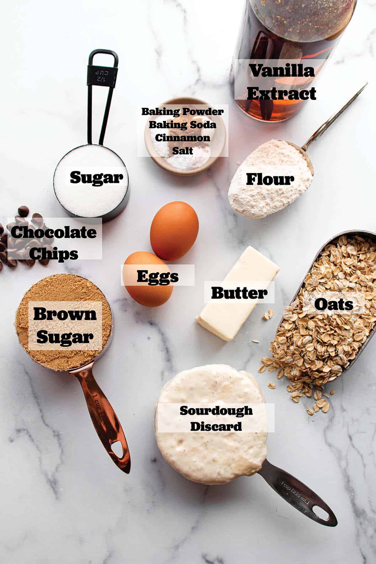 Vanilla extract, rolled oats, sourdough discard, butter, sugar, brown sugar, flour and other ingredients to make oatmeal cookies.