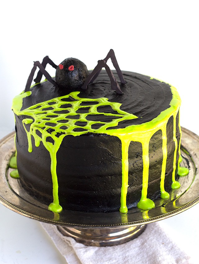 Spooky Spiderweb Cake - the perfect chocolate Halloween cake with black chocolate frosting and toxic green fluff sludge. It should be at all the parties!
