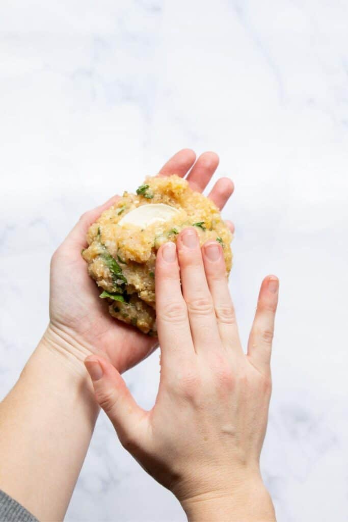 stuffing fresh mozzarella to the center of the ground chicken patty