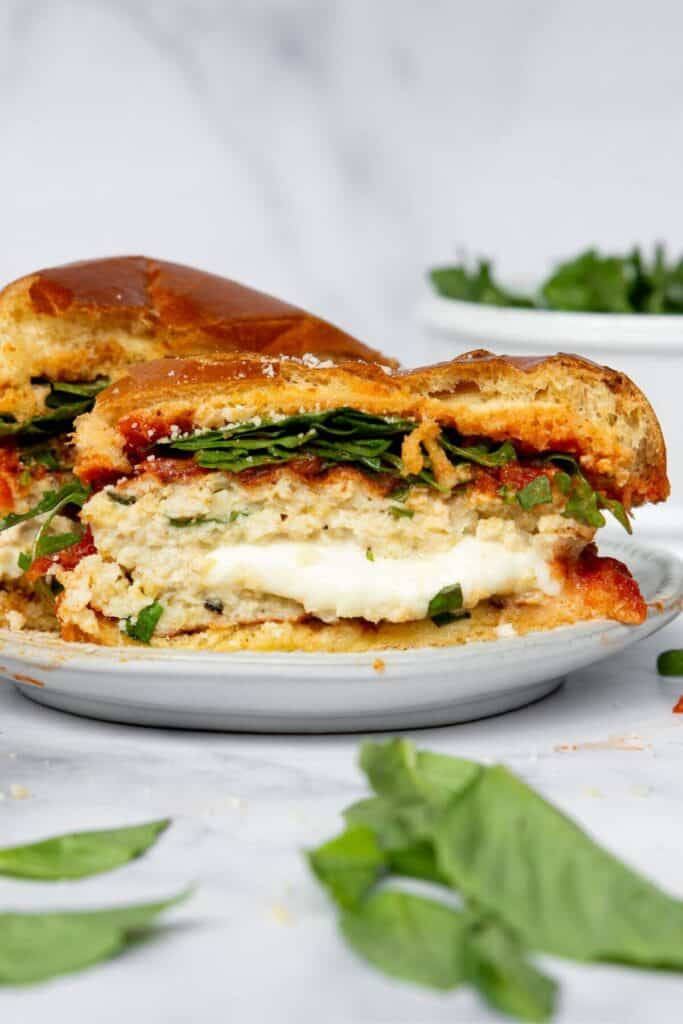 inside a mozzarella stuffed chicken burger to show the gooey cheese