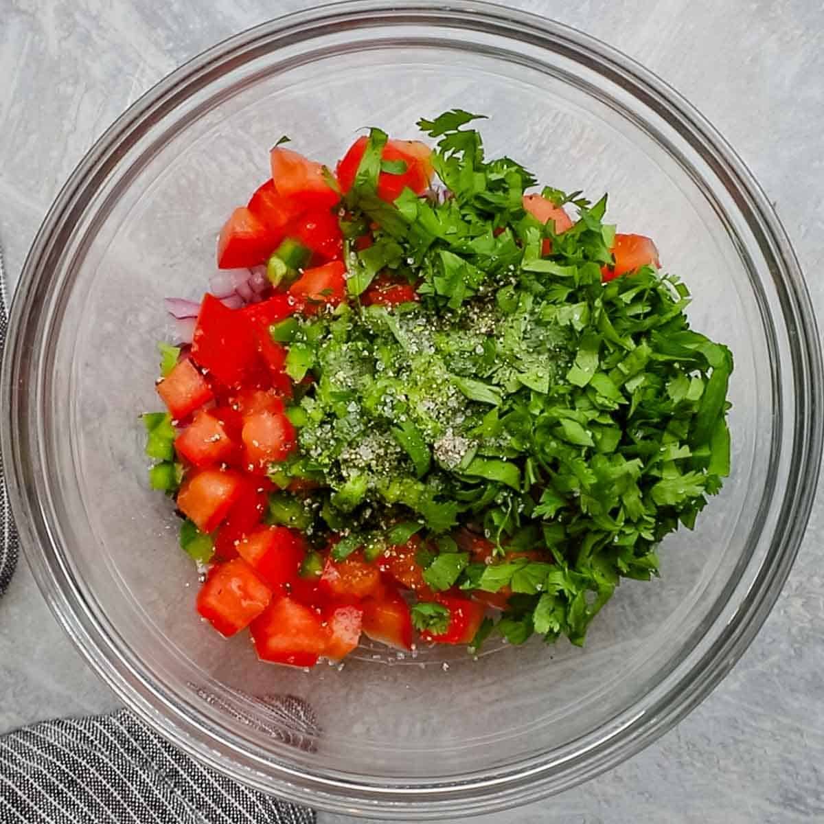 ingredients for pico de gallo in a bowl