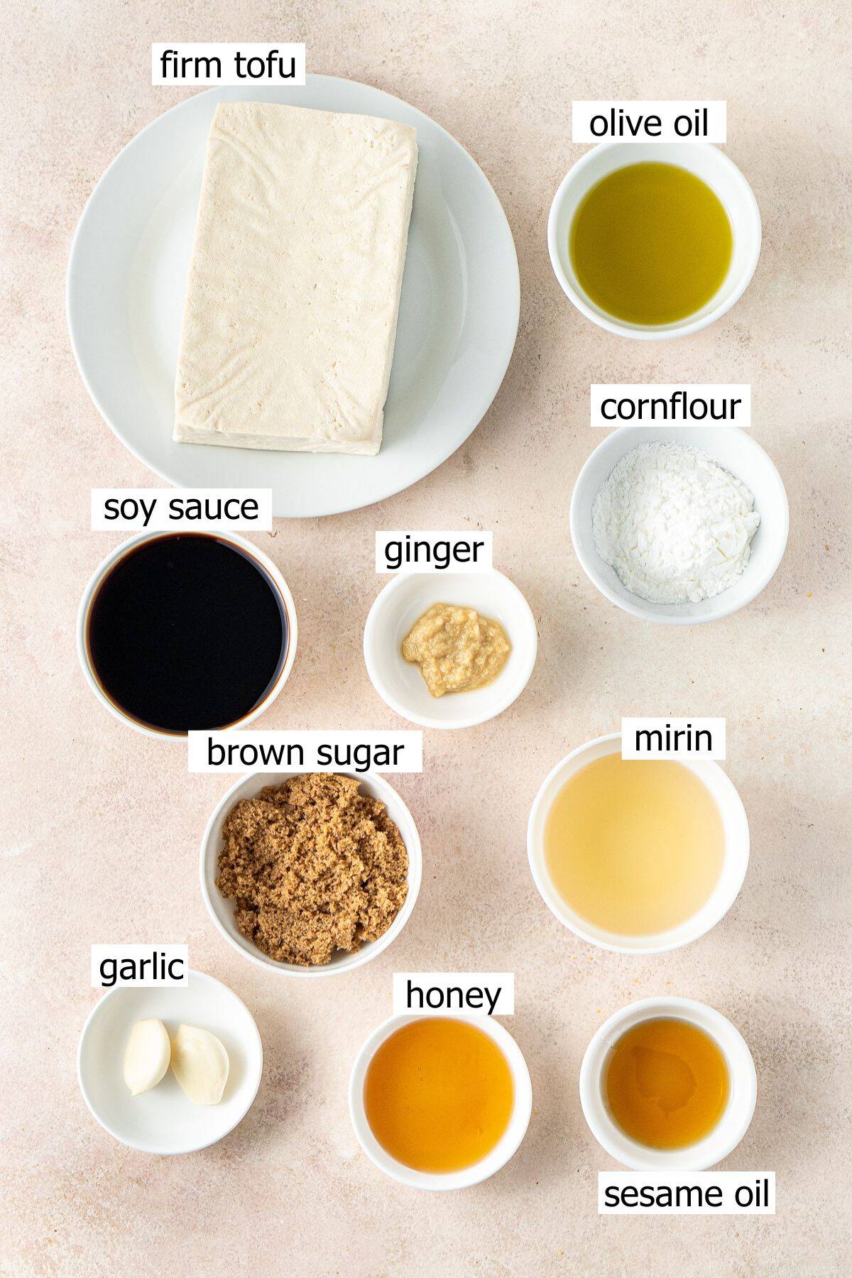 All ingredients needed to make tofu teriyaki laid out in small bowls.