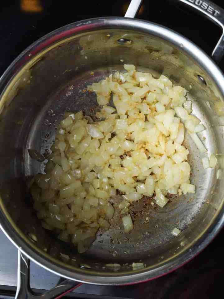 Photo of onion and garlic in the pan once browned.