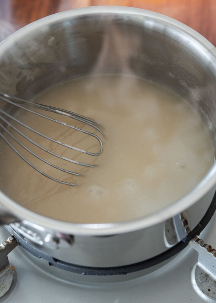 Cooking sweet rice flour in a pot.