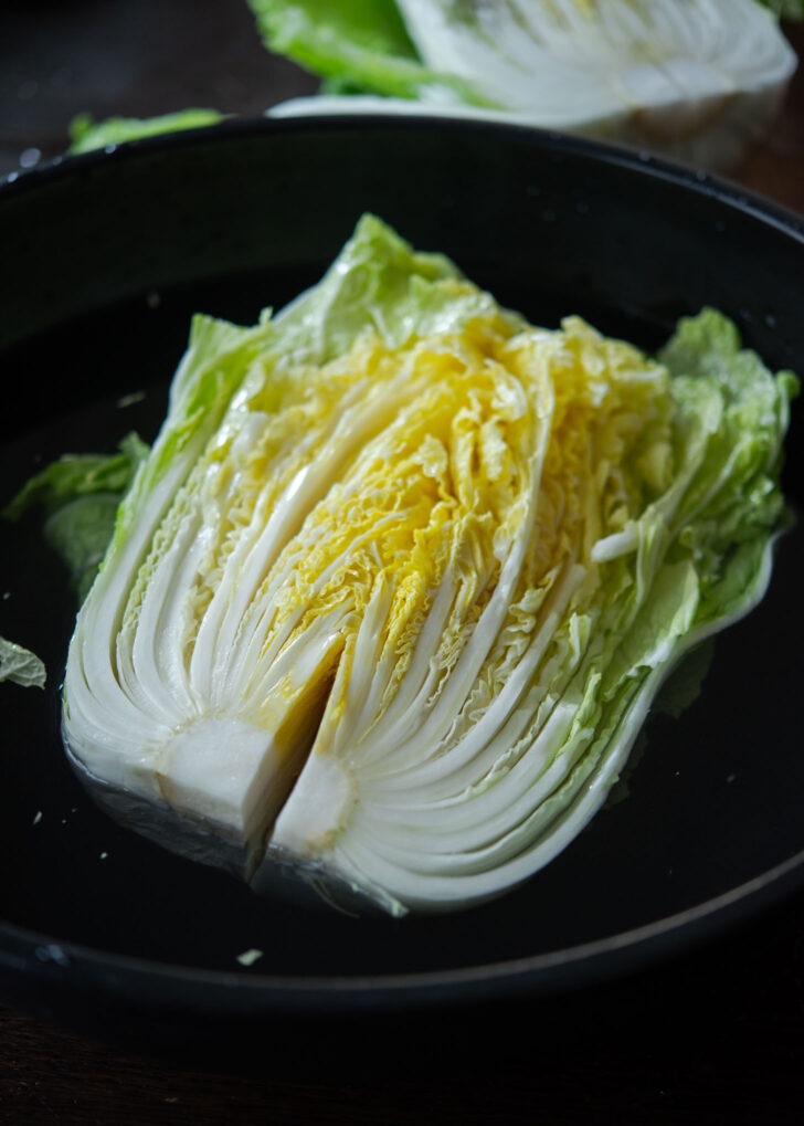Soaking the cabbage in saltwater solution.