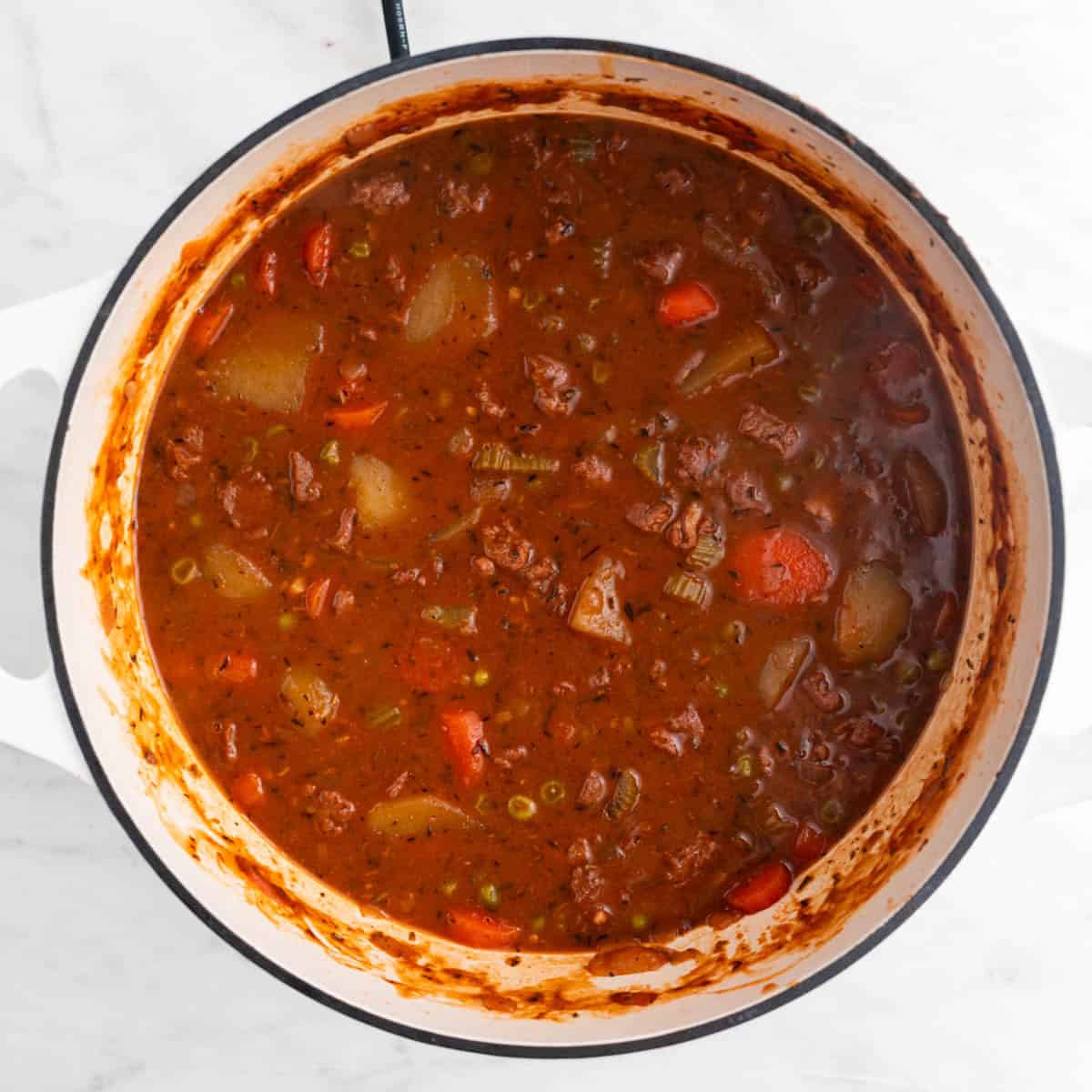 Vegan beef stew cooked in a large pot.