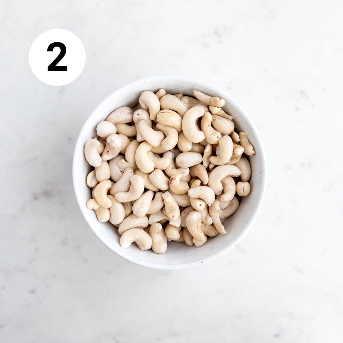 Drained and rinsed cashews in a bowl.