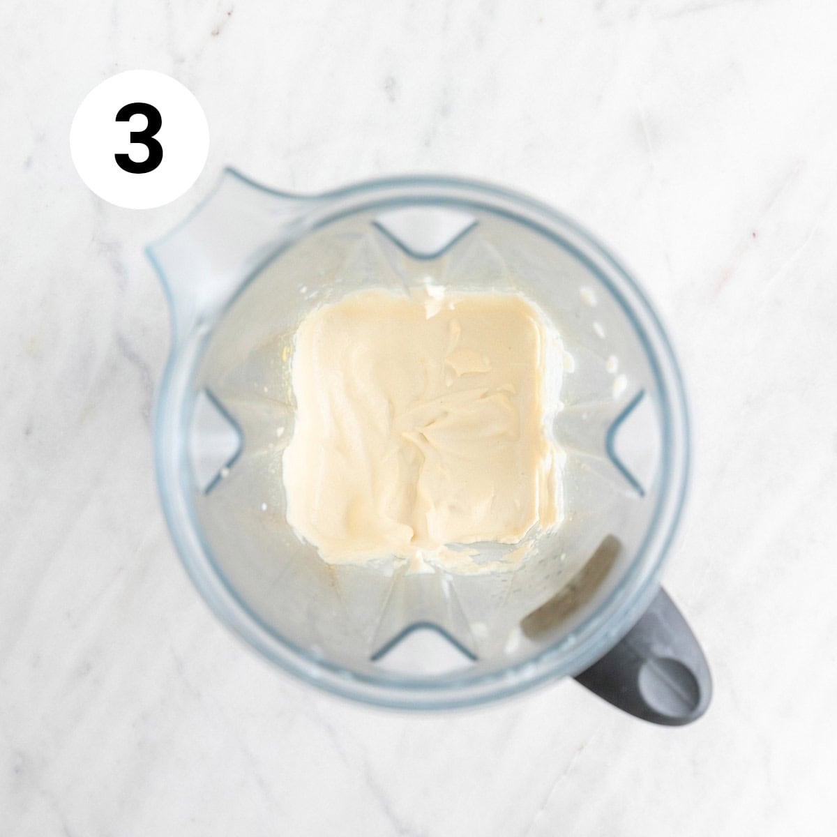   Vegan cream cheese in a blender jar.