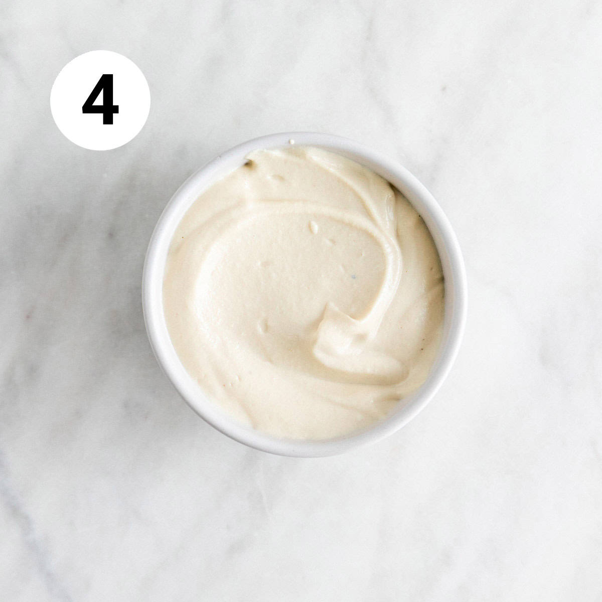 Vegan cream cheese in a small bowl.