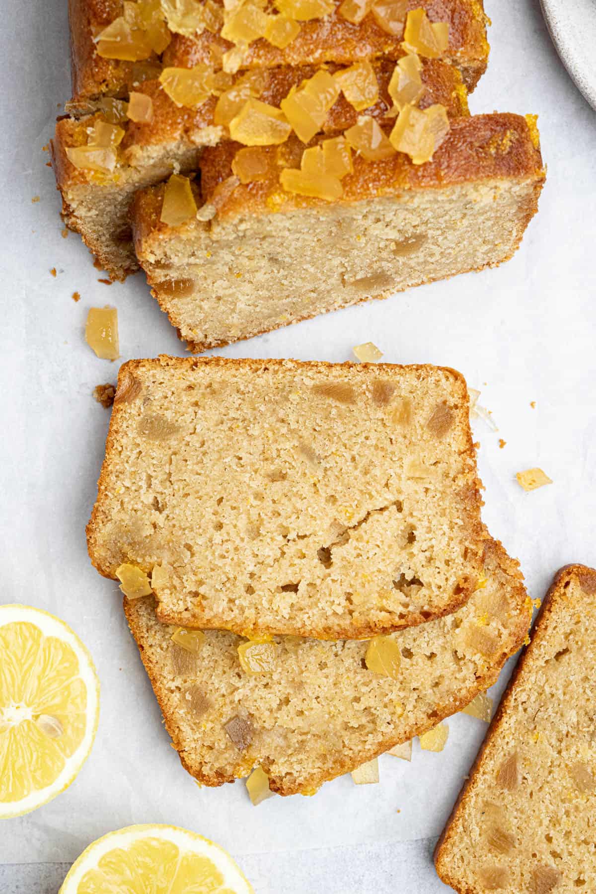 Close up of a couple of slices of lemon and ginger drizzle cake.