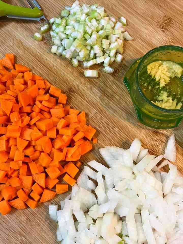 Method photo 1 showing chopped up veggies on a board.