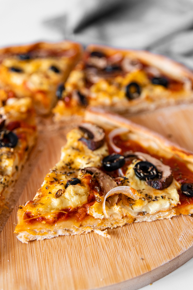 Photo of a slice of vegan pizza