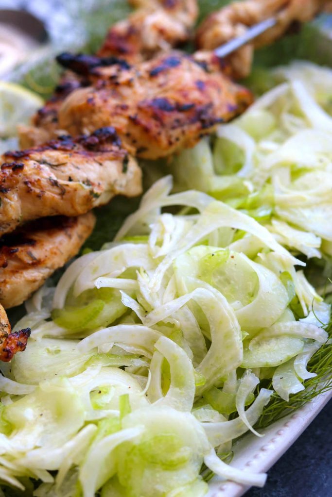 shaved fennel, cucumber and celery salad with chicken skewers